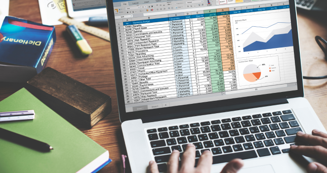 Data management in progress on a laptop screen showing an open spreadsheet.