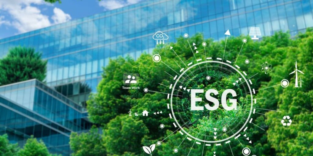 Holographic ESG logo and icons superimposed over a modern, glass building partially covered by lush trees